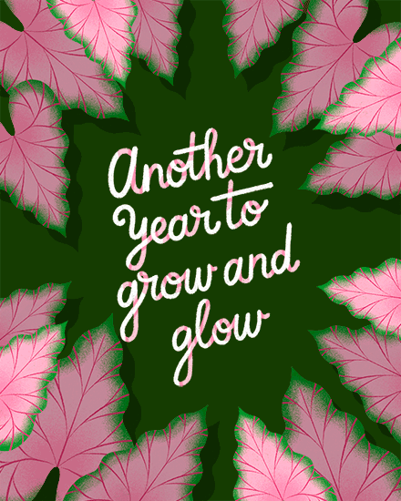 Pink veined leaves border a dark green center with “Another year to grow and glow” lettering.