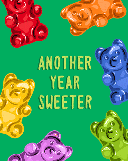 Colorful gummy bears around green background with centered text Another Year Sweeter