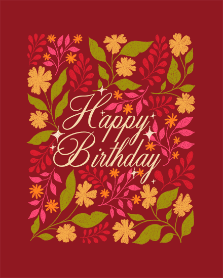 Happy Birthday script surrounded by colorful floral wreath on deep red background