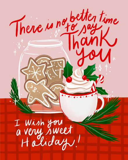 Festive cookies in jar with hot chocolate, holly leaves, and candy cane.