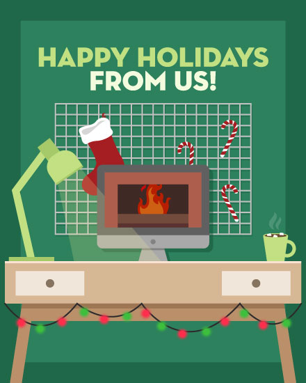 holiday season holiday card happy holidays from us desks in front of fireplace