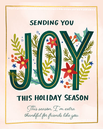 Decorative card with floral 'JOY' text and heartfelt holiday message.