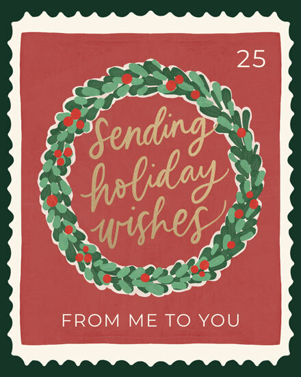 Greeting card with festive wreath and text 'Sending holiday wishes'.