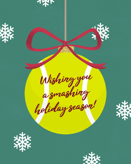 Tennis ball ornament with burgundy bow and snowflakes on green background.